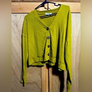 A green long sleeve sweater
